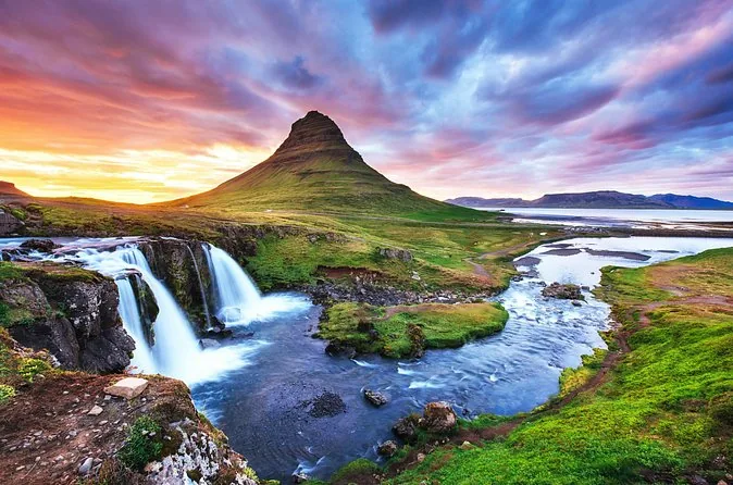Kirkjufell above the Kirkjufellsfoss waterfall at sunset