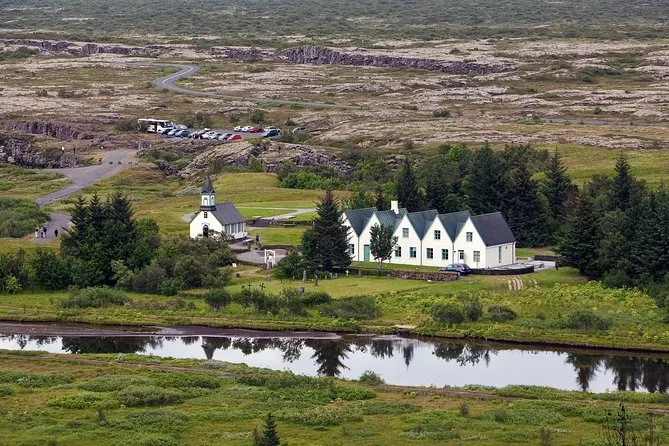 The church and farmhouses at Thingvellir beside a river
